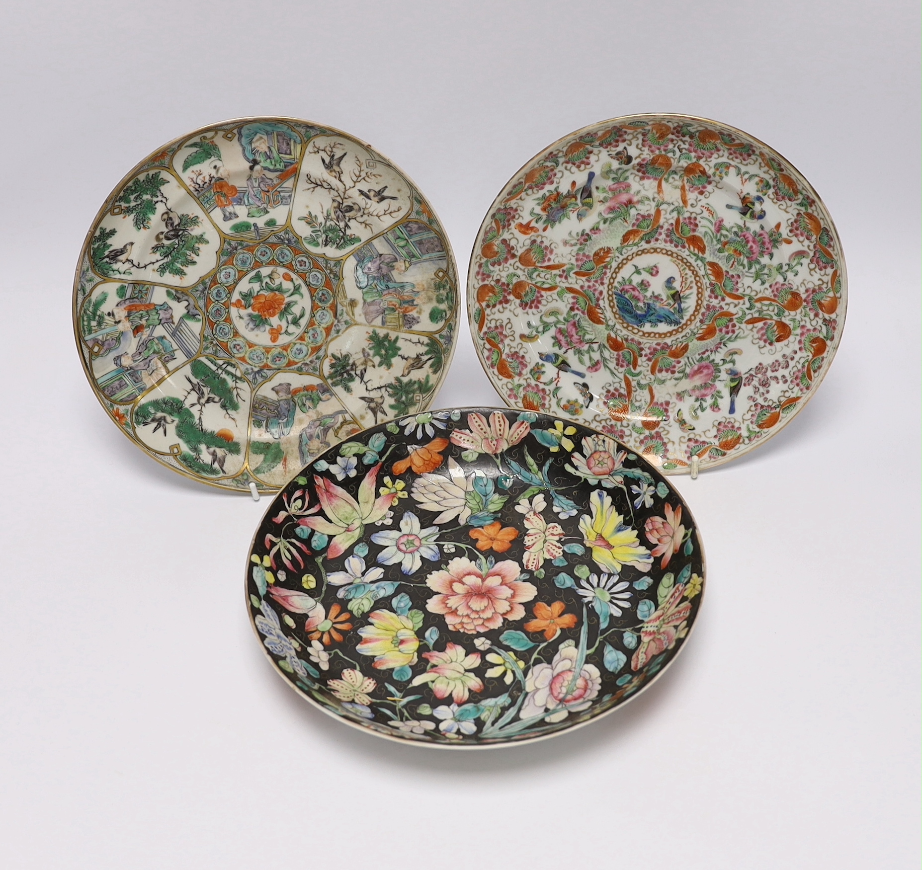 A Chinese famille noire floral dish, Qianlong mark, late 19th/early 20th century and two Chinese enamelled porcelain plates, 19th century, famille noir dish 23.5cm diameter
